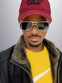 a man wearing sunglasses and a hat