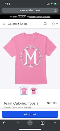 a pink shirt with a monogram on it